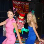 The Mad Hatter with sexy dancing girls